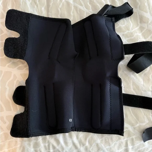 Black knee brace with Velcro straps